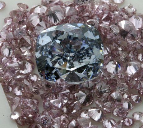 The same fancy blue cushion shape diamond, surrounded by intense pink brilliants