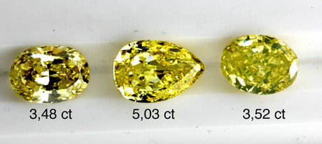 Three vivid yellow diamonds